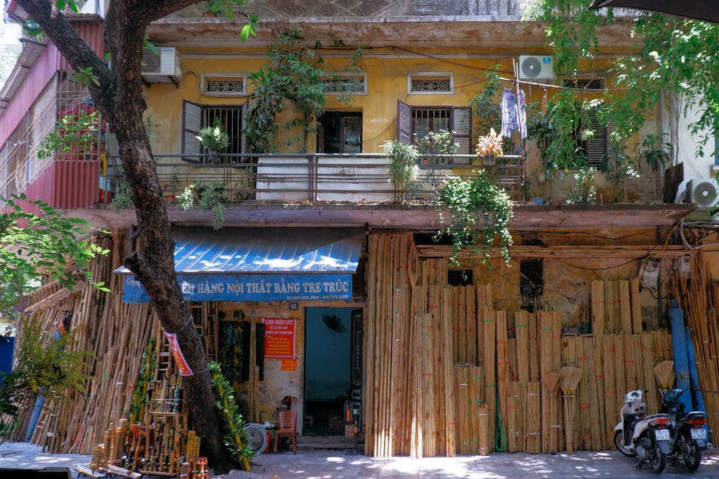 Charming traditional shopfront in Hanoi, Vietnam with bamboo and rustic architecture.