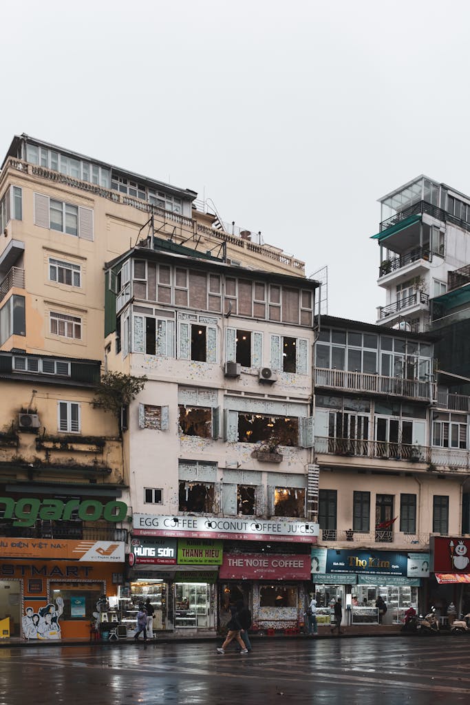 Explore the architectural variety of Hanoi's urban landscape showcasing eclectic buildings and street life.