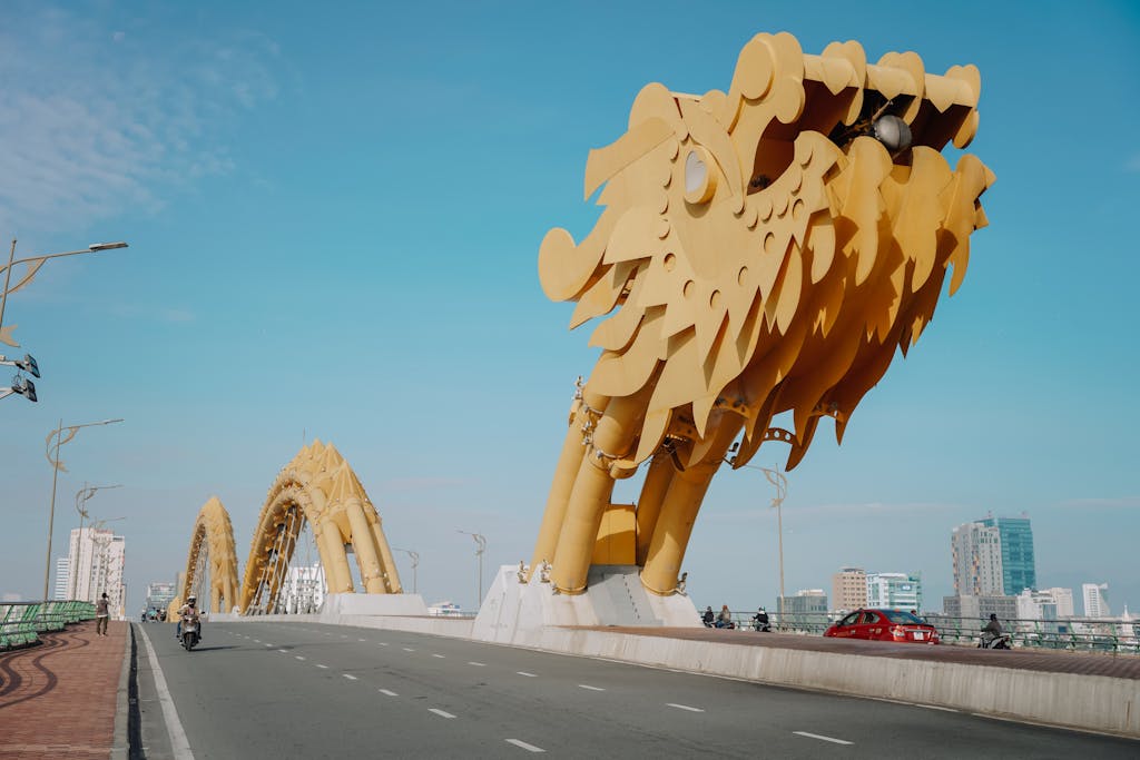 Stunning view of the iconic Dragon Bridge in Danang under a clear blue sky.
