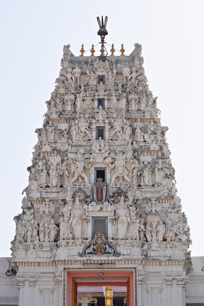 Intricately carved facade of the Sri Rama Vaikunth Temple in Pushkar, India, showcasing Hindu spirituality.